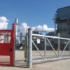 red full height gate installed in a fence line