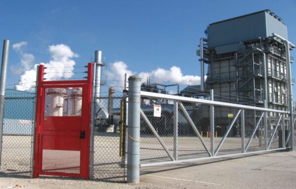 red full height gate installed in a fence line