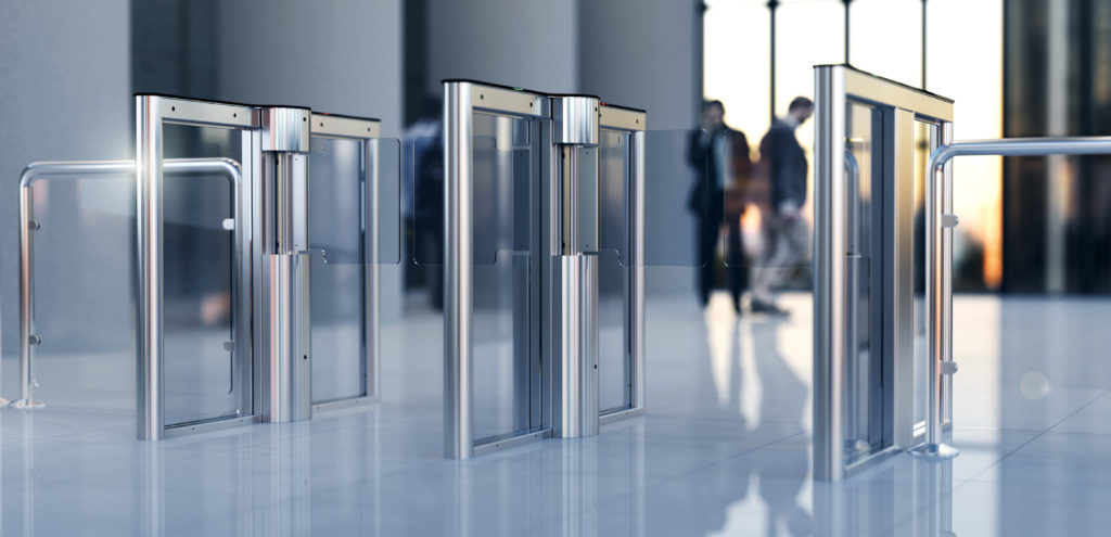 a line of three swing glass optical turnstiles installed in a high-scale corporate office lobby