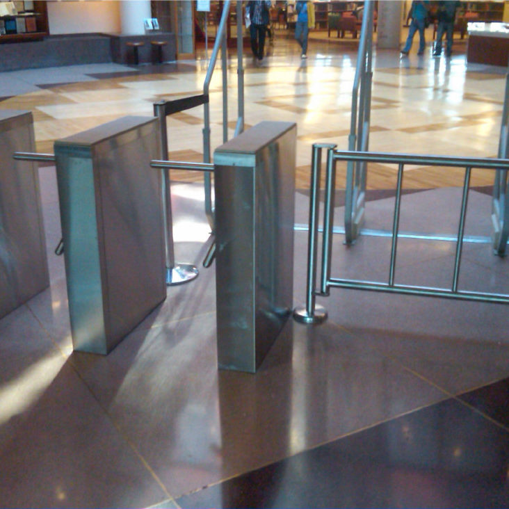Hayward Turnstiles security entry systems, gates. Queens College Library Tripod turnstile, ADA complaint security access gates, systems manufacturers, suppliers company