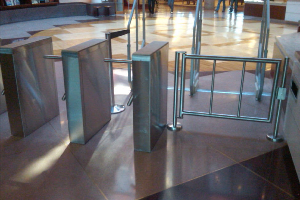 Hayward Turnstiles security entry systems, gates. Queens College Library Tripod turnstile, ADA complaint security access gates, systems manufacturers, suppliers company