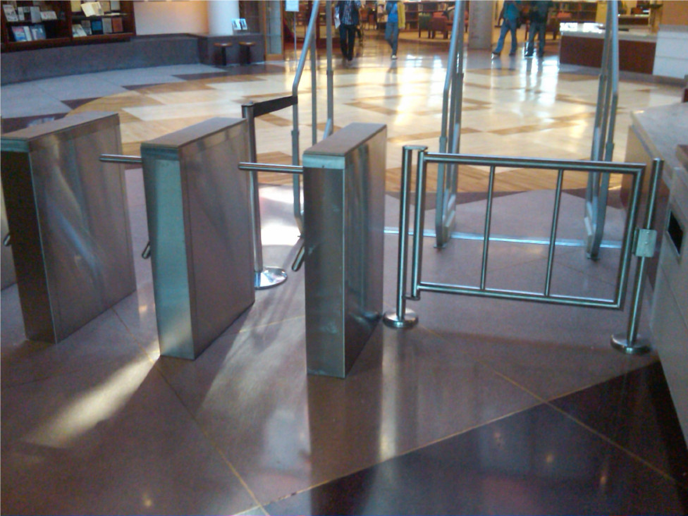 Hayward Turnstiles security entry systems, gates. Queens College Library Tripod turnstile, ADA complaint security access gates, systems manufacturers, suppliers company
