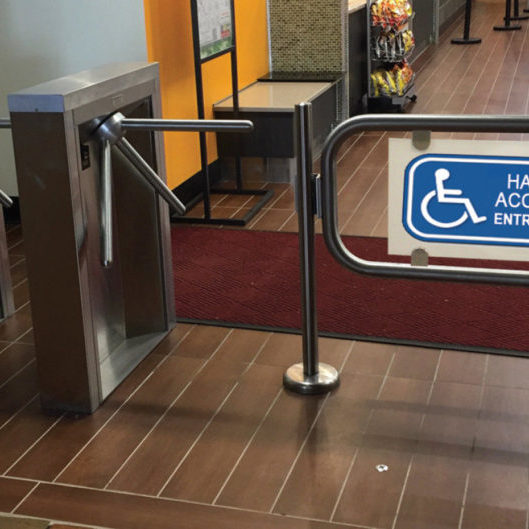 Hayward Turnstiles handicap gate swing arm security entry systems. Tripod turnstile, ADA complaint security access gates, systems manufacturers, suppliers company