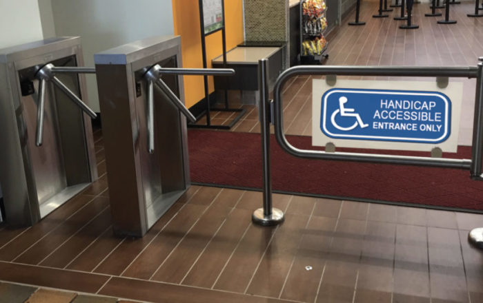 Handicap accessable security gate access sytem. Hayward Turnstiles ADA swing gate entrance for lobby, library, office