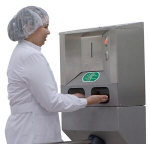 roser group hand sanitizer unit woman using integrated hand sanitizing unit on a waist high turnstile