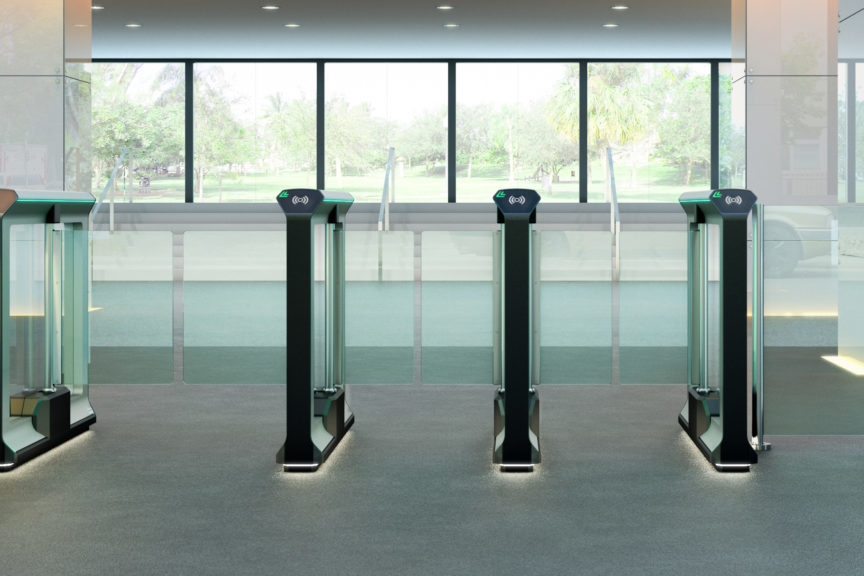 row of optical turnstile swinging glass barrier lanes in an office building