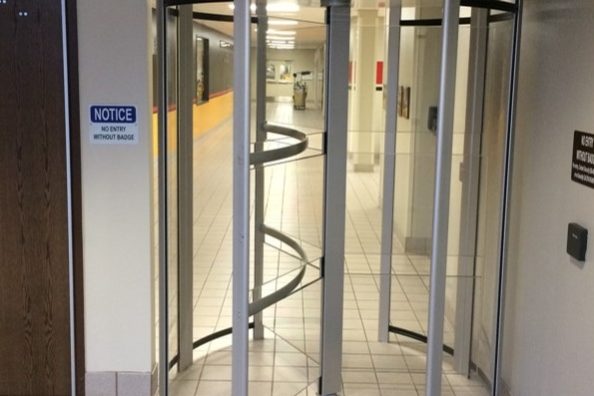 revolving door turnstile installed at an entryway