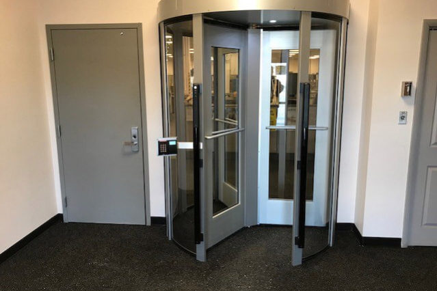 full height revolving turnstile in an entryway controlling access into building
