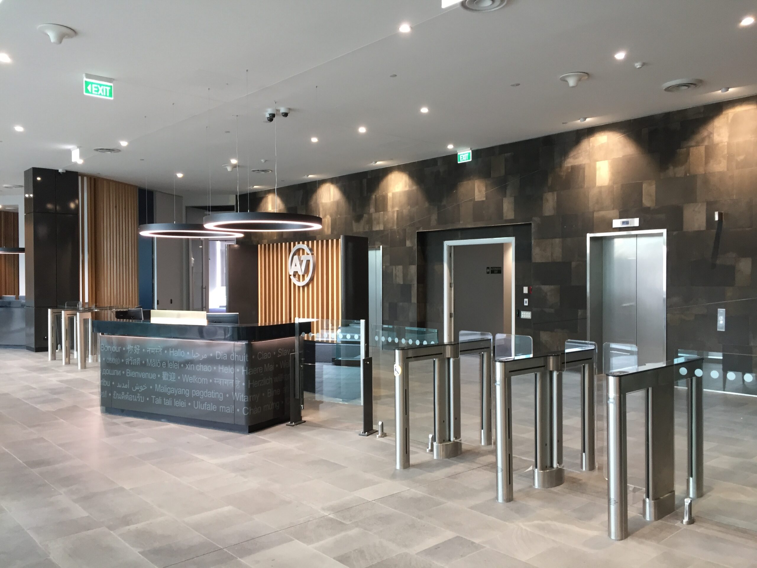 optical swinging glass turnstiles in an upscale office lobby access control