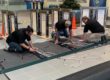 Avant-Garde Turnstiles team installing optical turnstiles